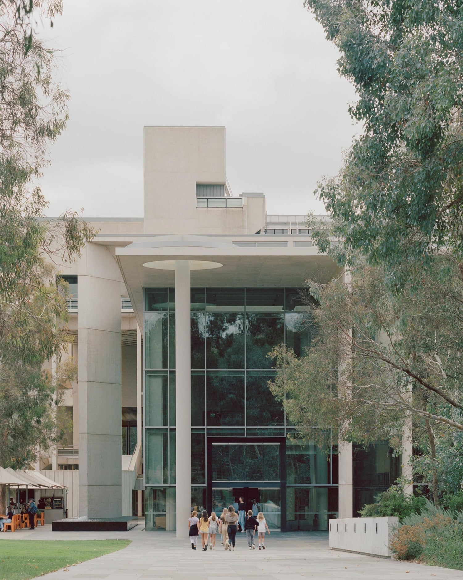 A group of students, walking outside of the National Gallery of Australia.